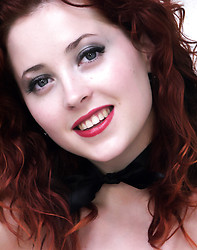 Gorgeous red head in short skirt and stockings teases off her clothes - Photo #17
