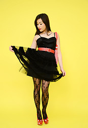 Pretty brunette in sexy patterned stockings and a short see through miniskirt. - Photo #3