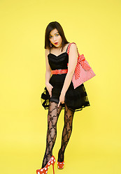 Pretty brunette in sexy patterned stockings and a short see through miniskirt. - Photo #4