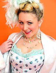 Saucy blonde showgirl in corset and white fishnet stockings knows how to tease. - Photo #2