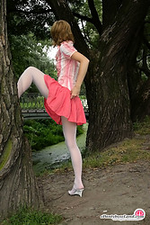 Blonde teen in flying skirt and white hose putting on upskirt show outdoors - Photo #2