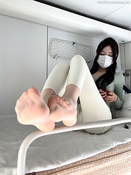 Asian babe flashing her legs in feet in pantyhose in the train - Photo #6