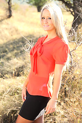 Candice flashes her panties then ditches her top right there in the middle of that open field - Photo #1