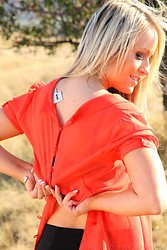 Candice flashes her panties then ditches her top right there in the middle of that open field - Photo #8
