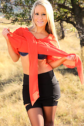 Candice flashes her panties then ditches her top right there in the middle of that open field - Photo #11