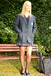 Kelly strips that schoolgirl uniform right off, black bra barely containing those perky tits underneath - Photo #1