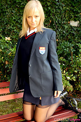 Kelly strips that schoolgirl uniform right off, black bra barely containing those perky tits underneath - Photo #4