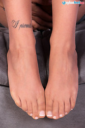 Petra slips off her pantyhose and dangling stiletto heel shoe to show off her perfect pedicure and playful toes. - Photo #16