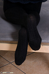 Petra stretches those toned legs and peels down her nylon pantyhose - Photo #21