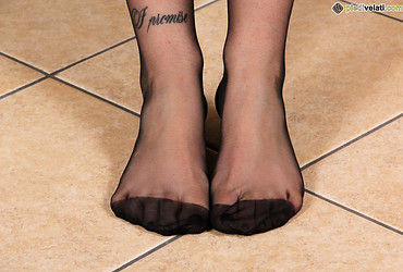 Petra's pantyhosed legs curl teasingly in her Adidas sneakers - Photo #21