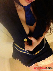 British glamour model Anastasia Harris shows off her stocking-clad thighs during a photoshoot. - Photo #4