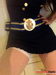British glamour model Anastasia Harris shows off her stocking-clad thighs during a photoshoot. - Photo #5