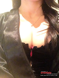 Anastasia Harris slips out of a red dress, revealing black lace lingerie, stockings and heels. - Photo #5