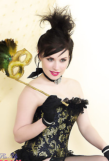 Heavenly brunette model in corset and black seamed stockings teases you.