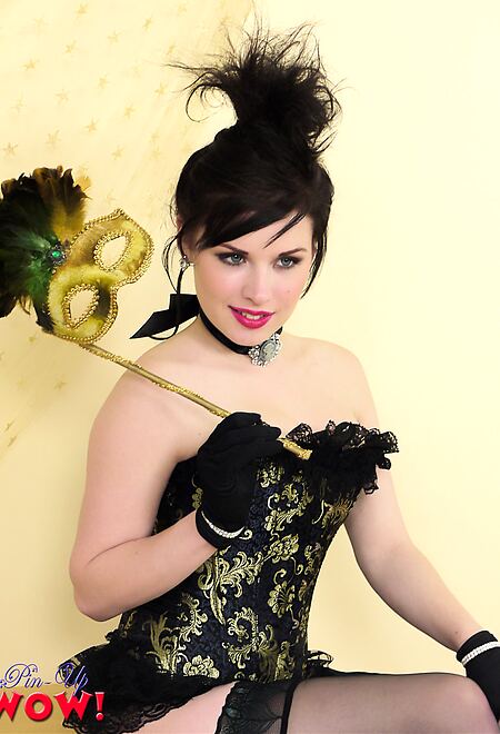 Heavenly brunette model in corset and black seamed stockings teases you.