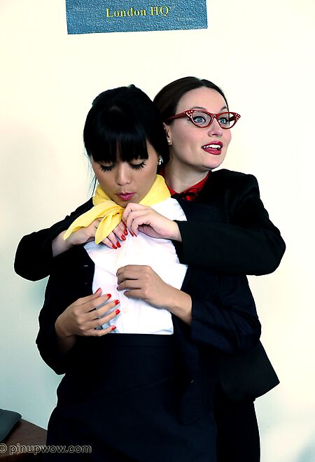 Two naughty office girls fall out in the office and decide to teach each other a naughty lesson.