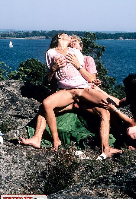 Lonely girl walking by the beach is surprised by two friends
